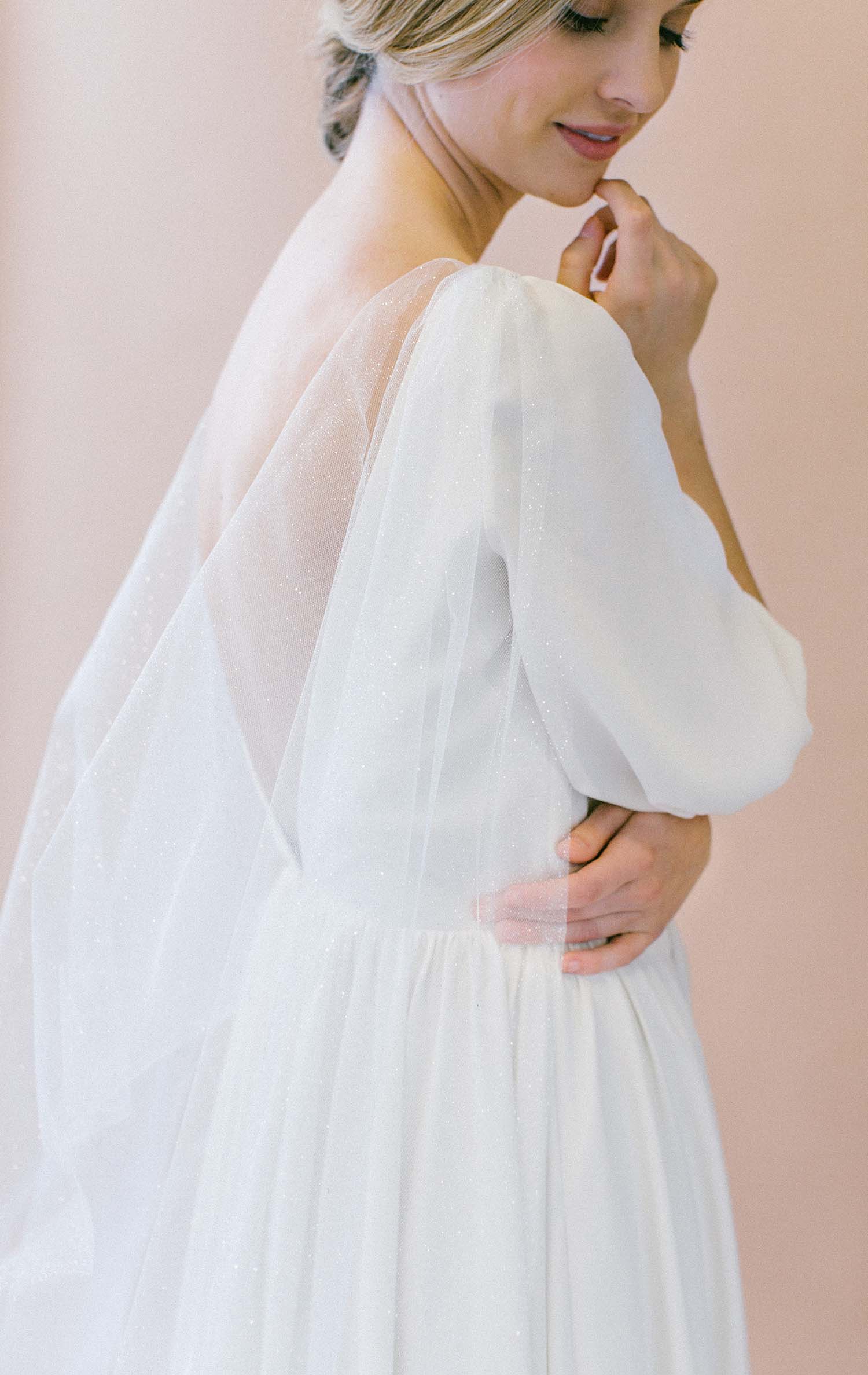 Close up of luminous shimmer tulle on DELYTH bridal cape