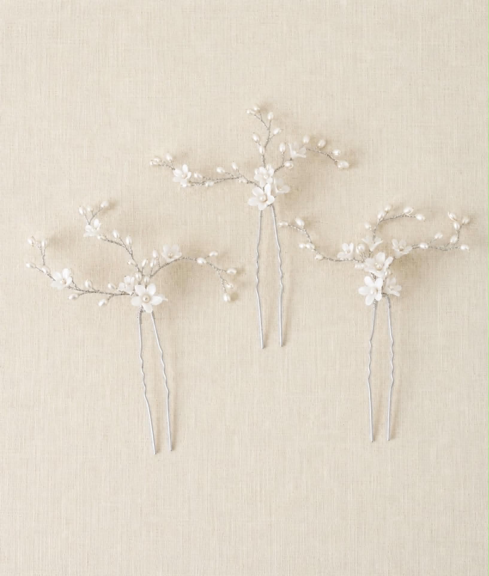 Delicate bridal hair pins inspired by fresh spring blossoms
