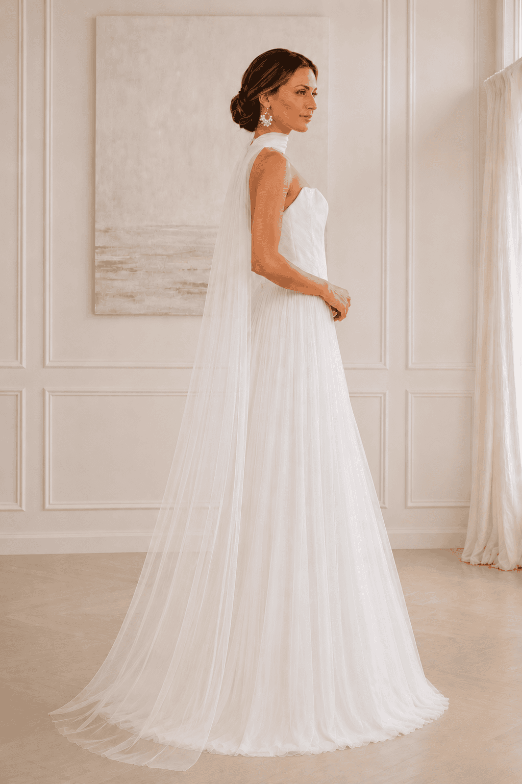 Side profile of bride wearing an ivory tulle bridal neck scarf